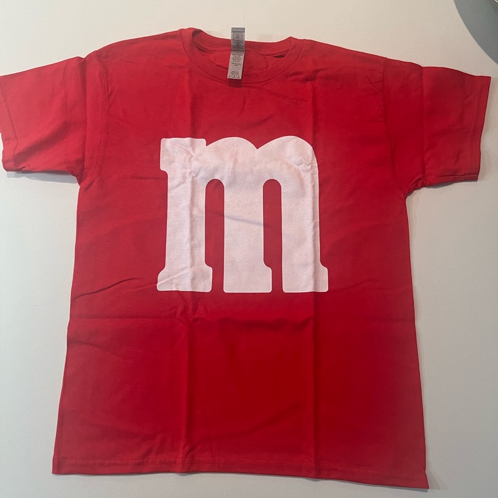 Red M&M t-shirt. Perfect for Halloween costume. Brand new, never worn. Youth L